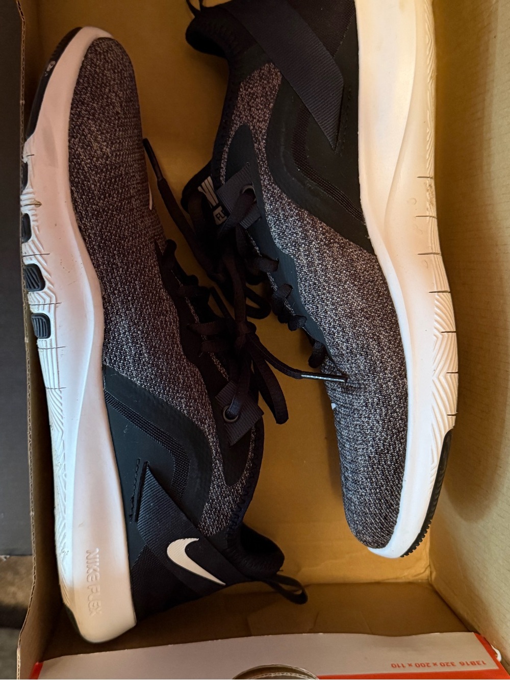 Nike women’s Black and White Knit Training Sneakers